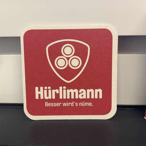 Bierdeckel mit Aufschrift:

Hürlimann
Besser wird's nüme