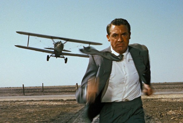 The famous movie still from North by Northwest: Cary Grant chased by a crop-duster plane.