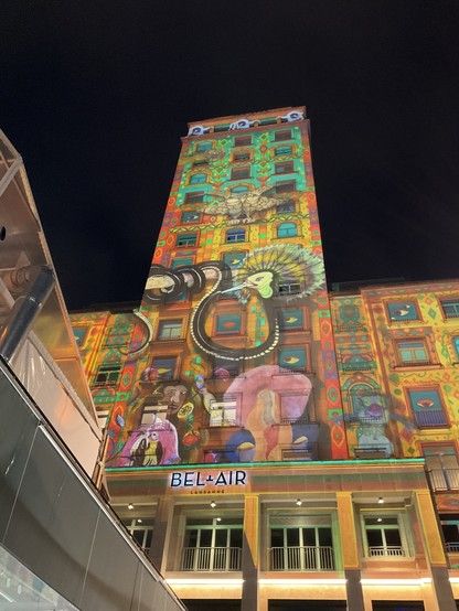 Projection on the Bel-Air tower. A mix of animals and patterns, hard to describe.