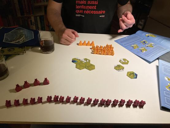 set up, four tiles placed, the red vikings are in one large line, the yellow gather